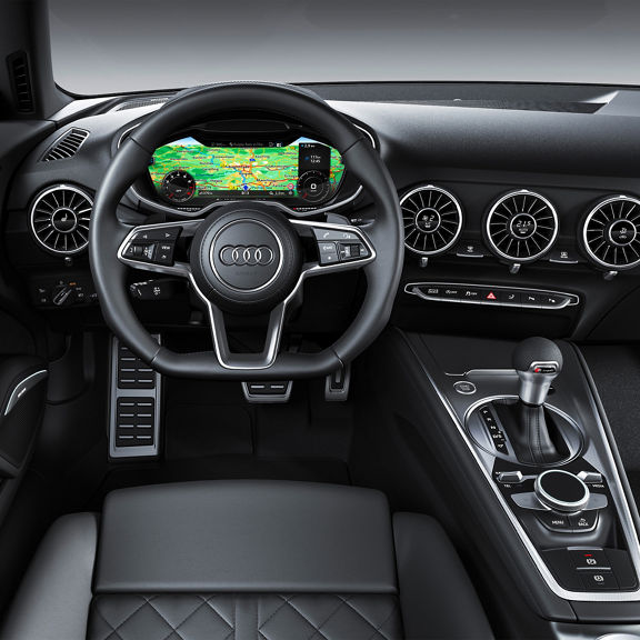 Interior shot of the drivers cockpit of an Audi TT vehicle.