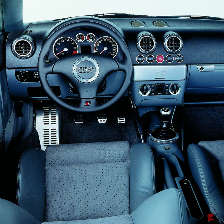 Interior view of the Audi TT Roadster steering wheel and dashboard. 