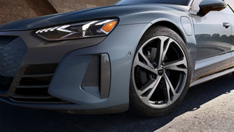 Close-up of the wheel of a gray Audi e-tron GT.