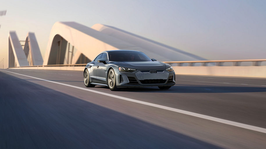 Side profile of the Audi e-tron GT accelerating.