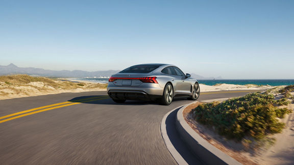 Three-quarter front view of the Audi RS e-tron accelerating. 