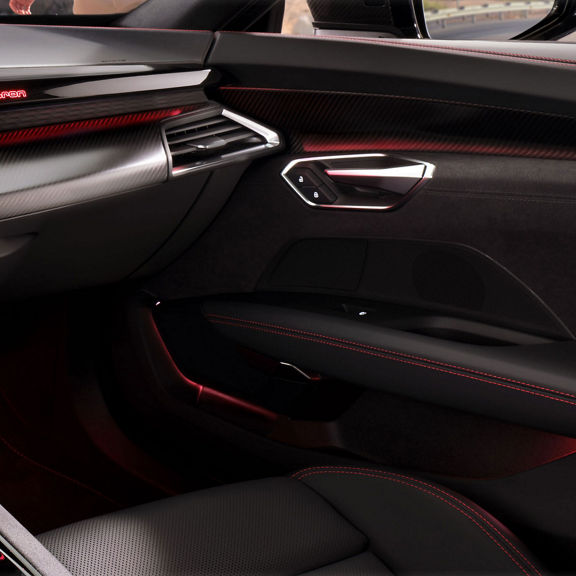 Close-up on the interior door sill of the Audi S e-tron GT, showing the interior lighting technology.