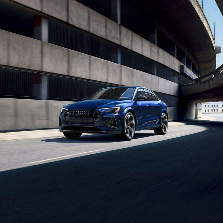 Front view of the Audi e-tron® Sportback accelerating.