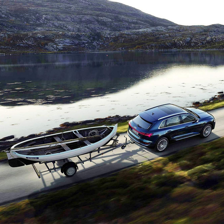 Aerial view of the e-tron Sportback towing a canoe.