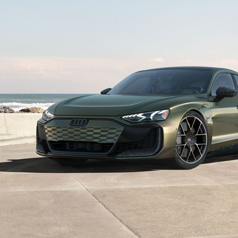 Front view of the Audi RS e-tron GT, showing the grille and headlights.