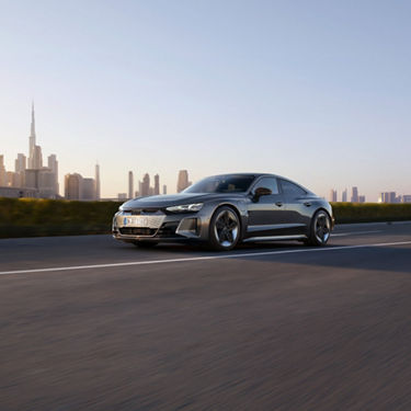 Three-quarter front view of the Audi RS e-tron GT accelerating.
