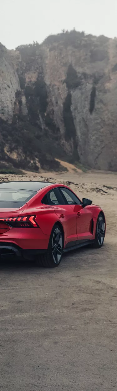 Three-quarter rear profile of the Audi e-tron GT.