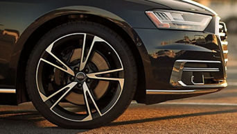 Close up on the tire of an Audi vehicle. 