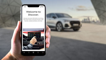 Close-up of the myAudi Discover tab interface on the myAudi app.