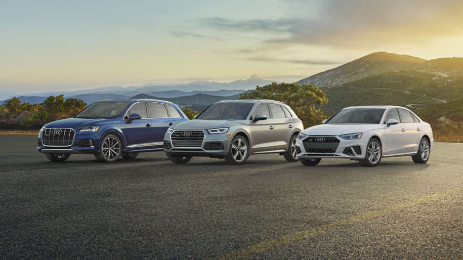 A lineup of 3 Audi vehicles.