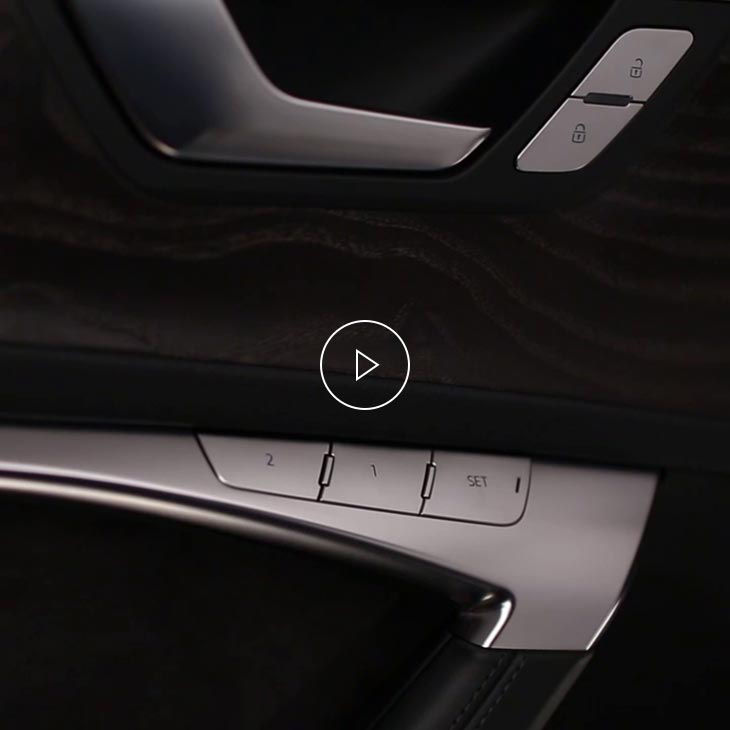 A close-up photo of the seat memory buttons inside an Audi vehicle.