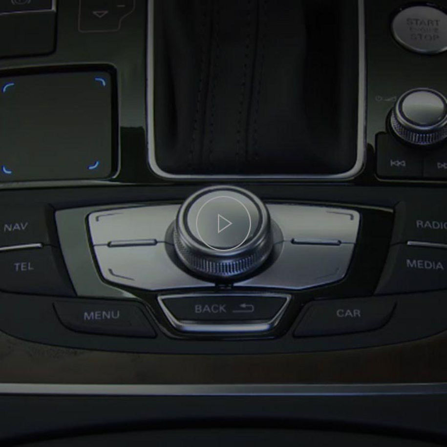 A close-up photo of the Audi MMI display inside an Audi vehicle.