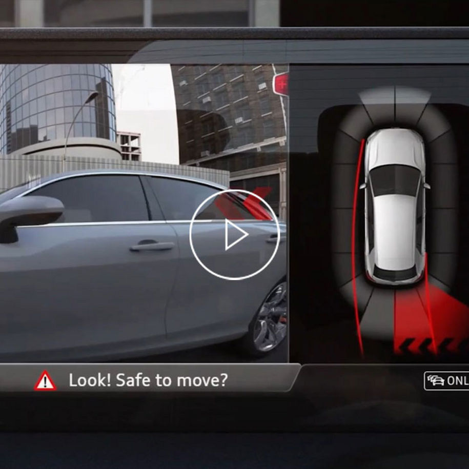 Close-up photo of the Rear cross traffic alert feature on the Audi MMI.