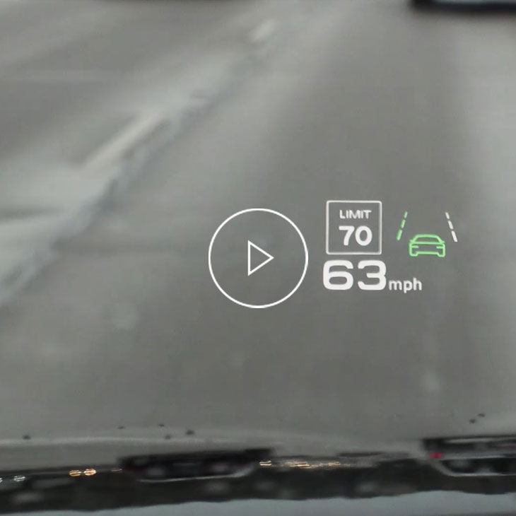 Close-up photo of the head up display inside an Audi vehicle displaying the traffic sign recognition feature.