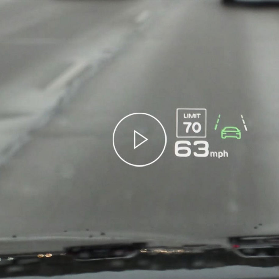 Close-up photo of the head up display inside an Audi vehicle displaying the traffic sign recognition feature.