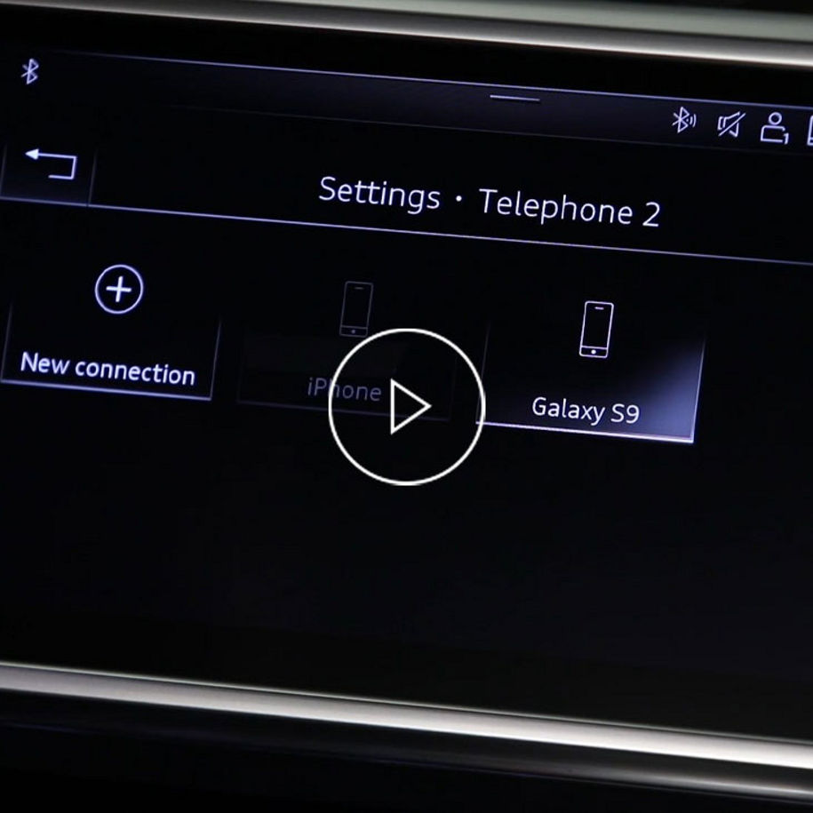 Close-up photo of the MMI screen in an Audi displaying the Bluetooth options.