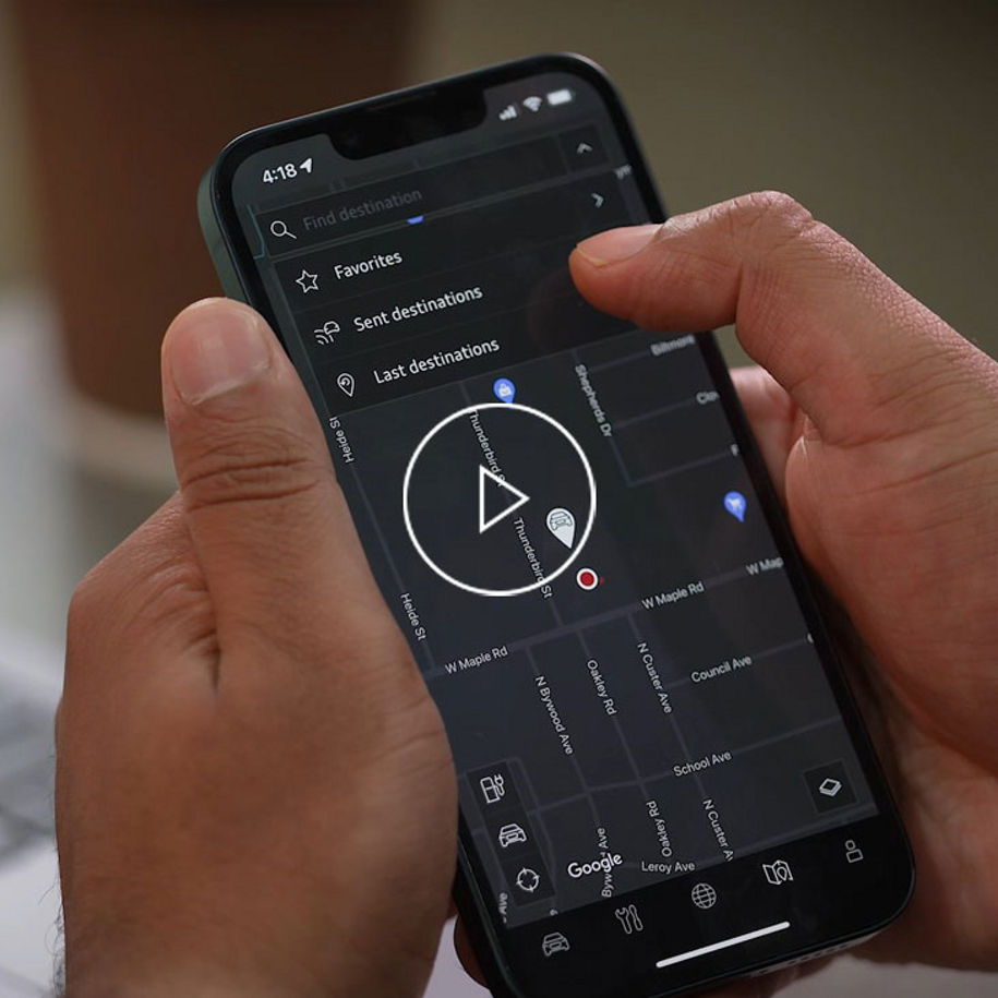 Close up on a mobile phone displaying the myAudi app.