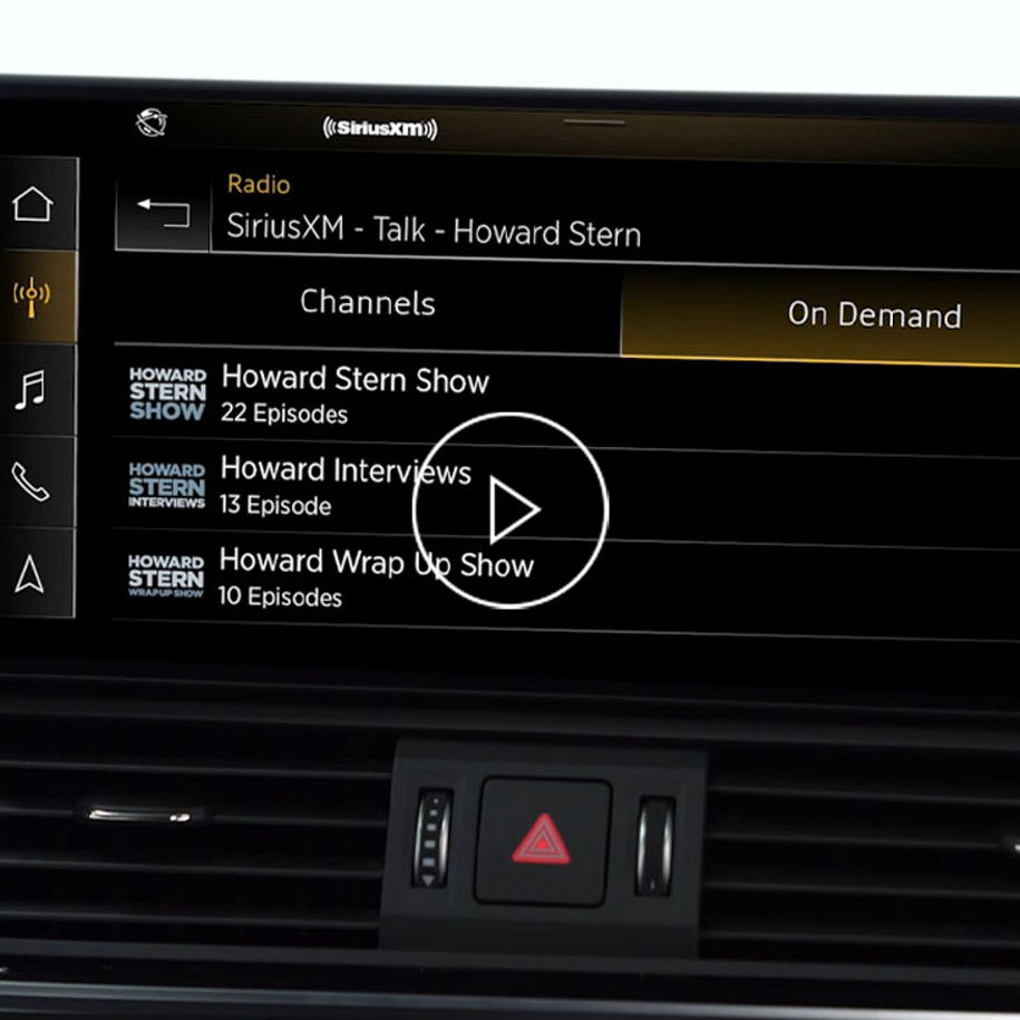 Close-up photo on the MMI screen displaying SiriusXM shows.