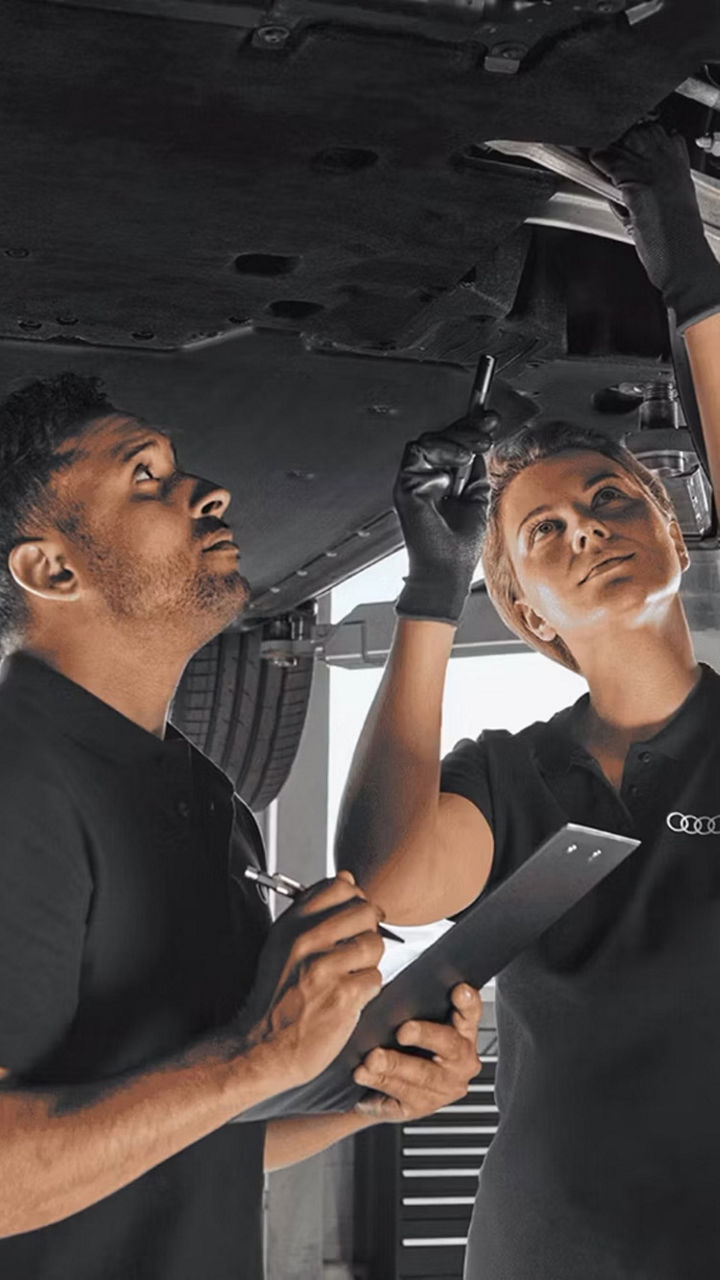 Audi Technicians working on a vehicle 
