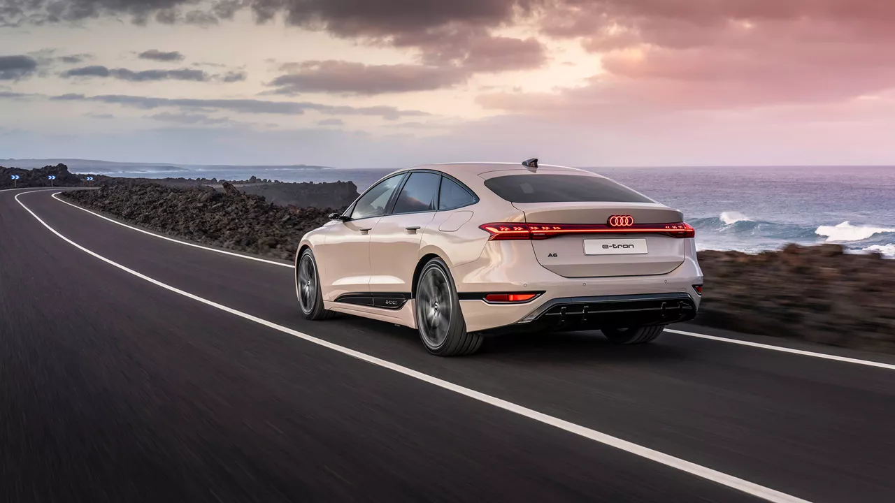 Audi A6 e-tron driving by water