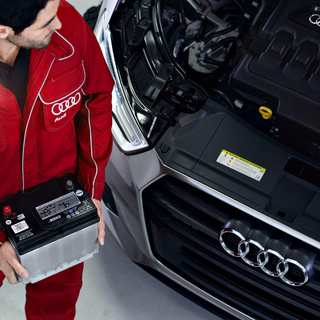 Front profile view of an Audi Q5 vehicle being serviced.