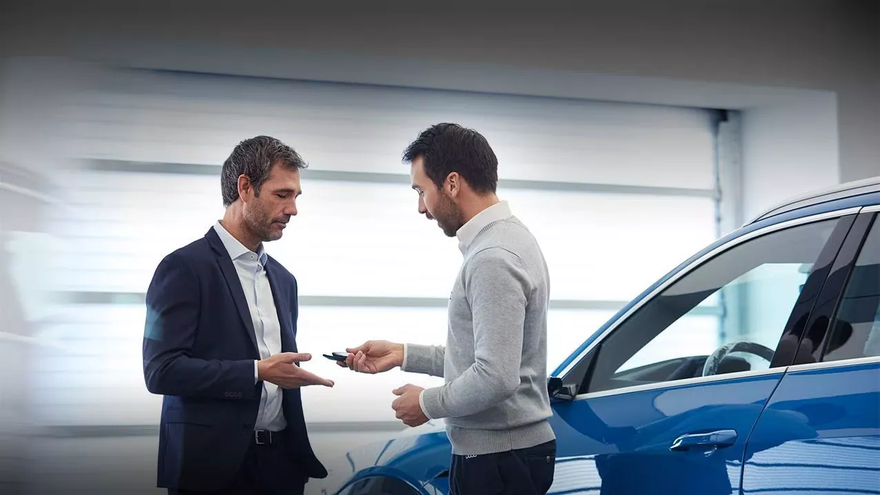 Audi sales technician working with a customer.