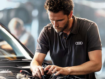 Service technician serving vehicle.