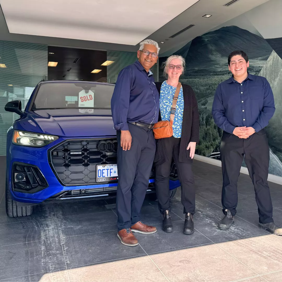 Image of an Audi being delivered to customers