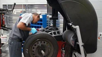 Audi Technician performing Tire Balancing