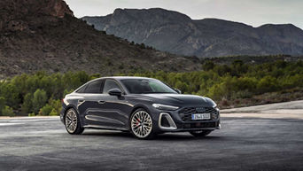 Three-quarter front view of a 2025 Audi A5 model.