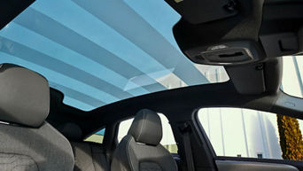 View of the 2026 Audi A6 e-tron's panoramic glass roof from the interior of the vehicle.