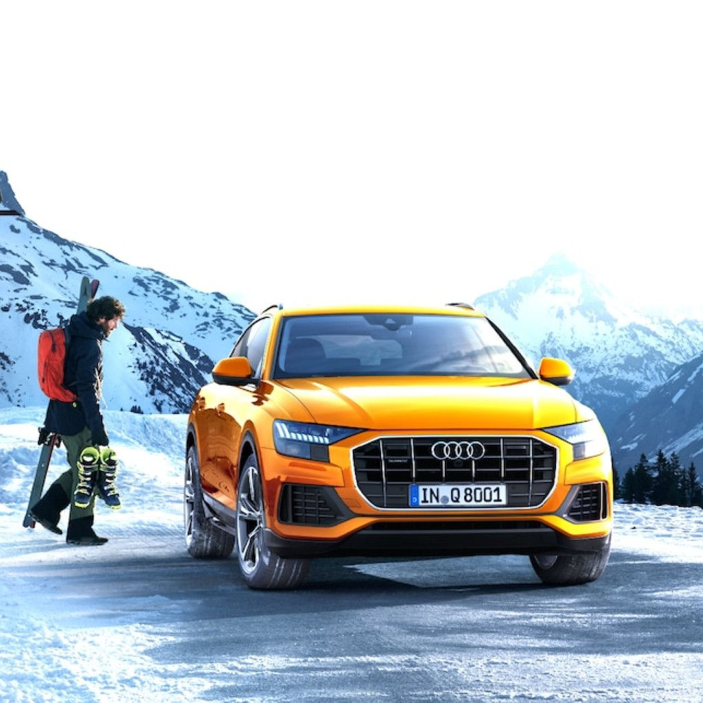 Audi SUV parked outside in winter.