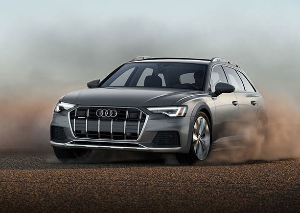 Profile view of Audi vehicle accelerating. 