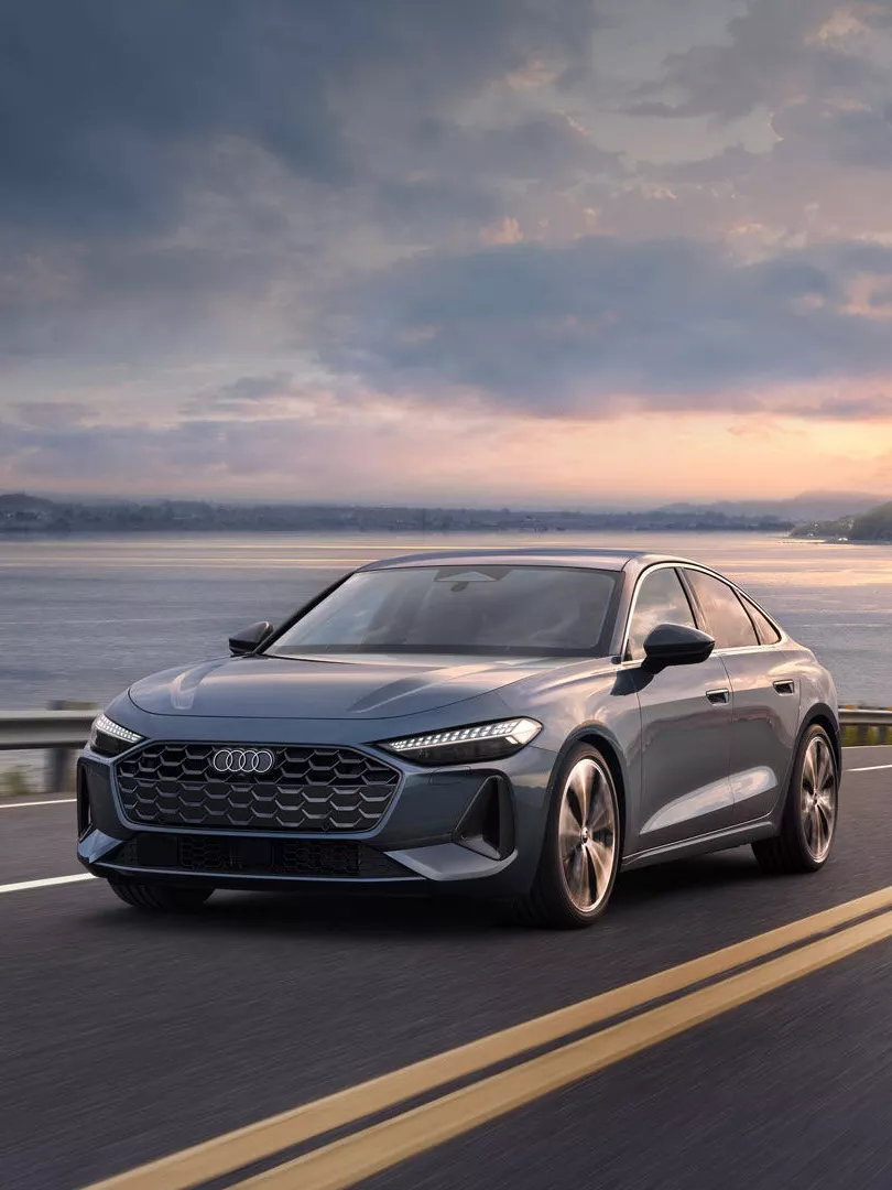 Right side profile view of an Audi accelerating.