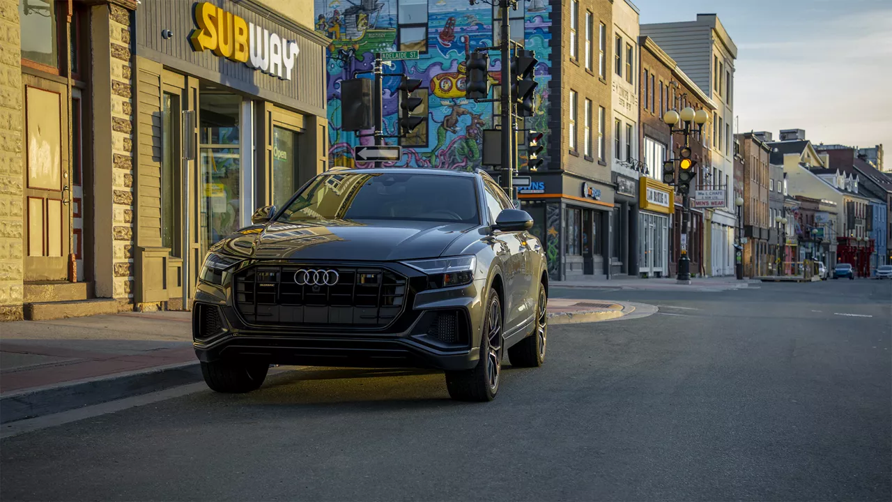 Left profile view of an Audi q8 vehicle parked.