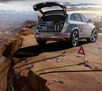 Audi SUV parked by mountain top