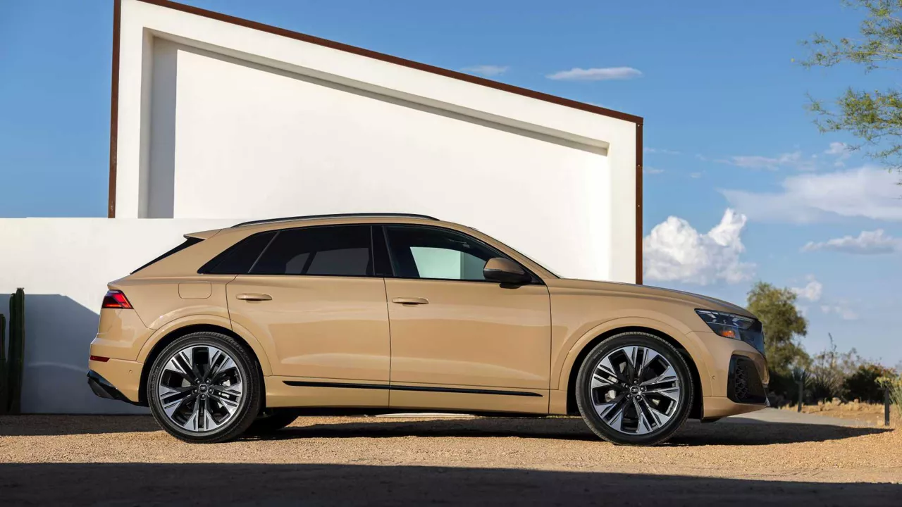 Right side profile view of an Audi Q8 SUV parked.