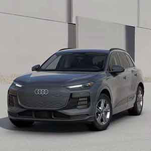 Side profile view of an Audi Q6 e-tron parked.