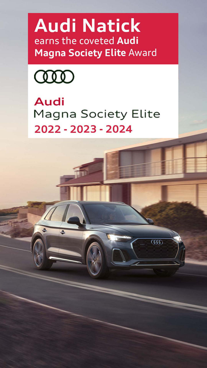 Left side profile view of an Audi vehicle accelerating.