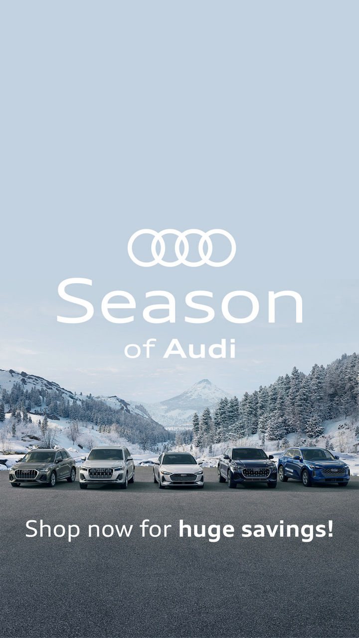 Left side profile view of an Audi vehicle accelerating.