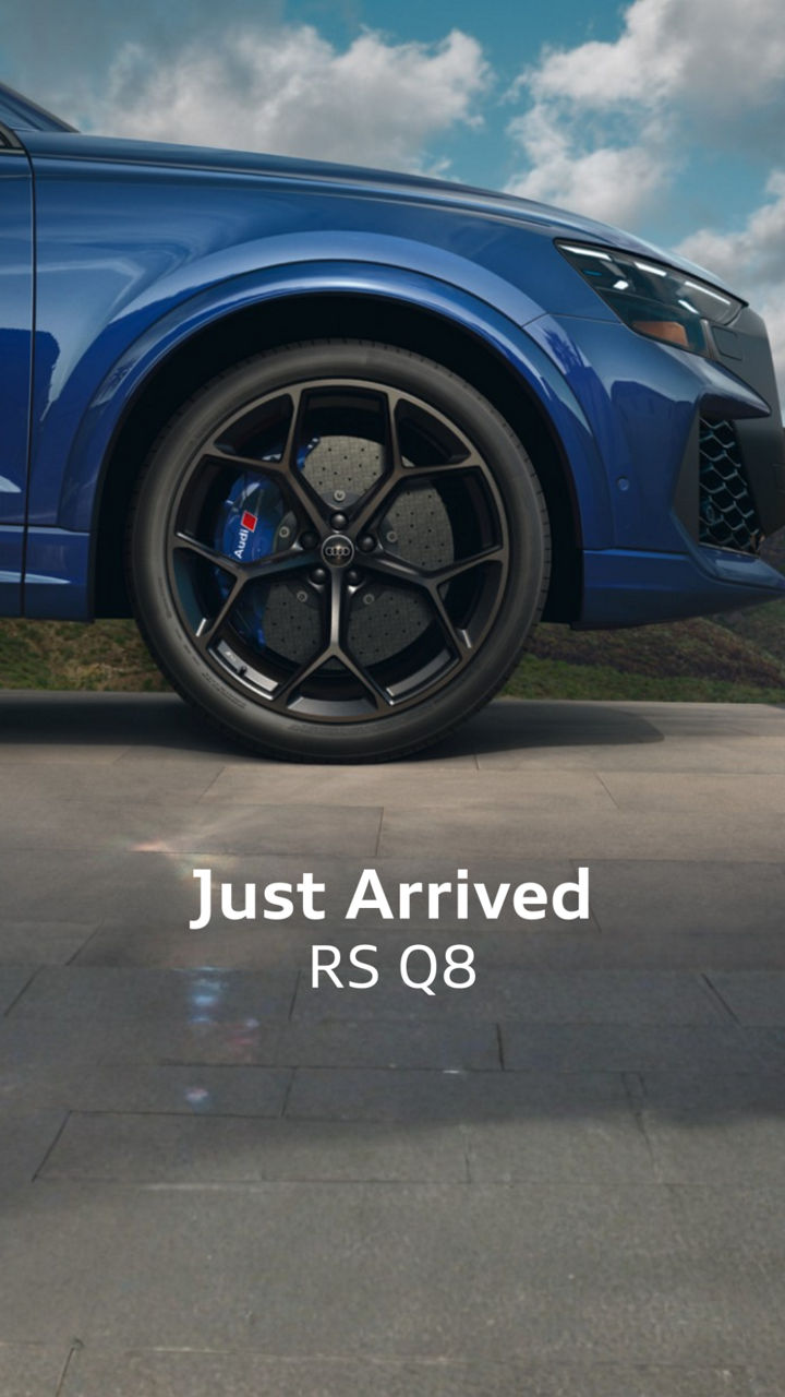 Right side profile view of an Audi parked
