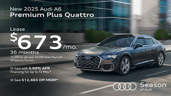 Side view of an Audi A6 accelerating.