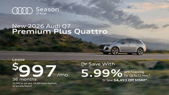 Side view of an Audi Q7 parked.