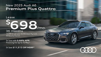 Side view of an Audi A6 accelerating.