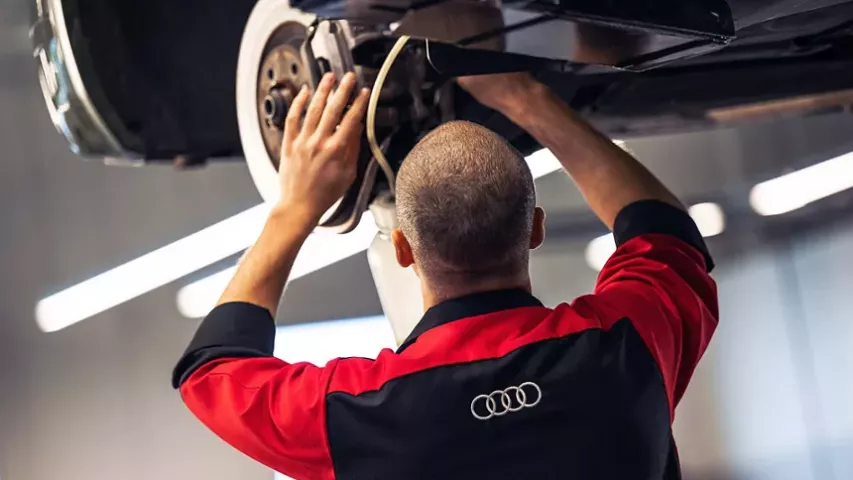 Service man working on brakes