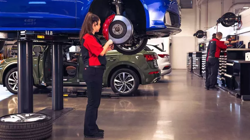 Service person working on brakes