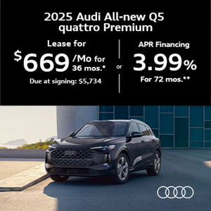 Audi Q5 parked by a building