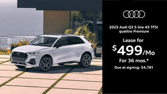 Q3 parked by a building