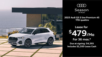 Q3 parked by a building