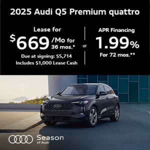 Audi Q5 parked by a building